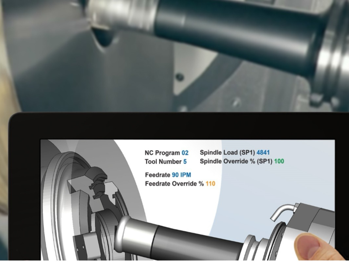 NC simulation software connected with a CNC machine shows machining values being monitored.